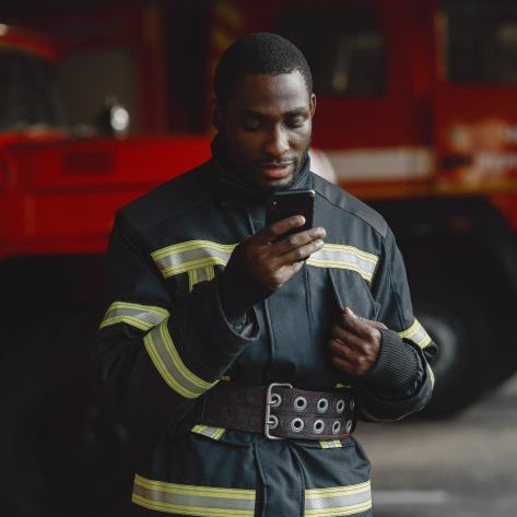 firefighter candidate looking at phone